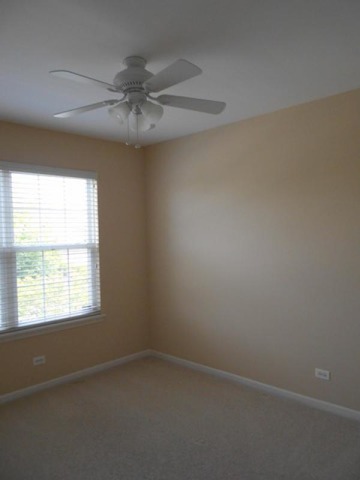 3040 Crystal Rock Road, Unit 3040 Naperville, IL 60564 - Photo 12 of 22 an empty room with a window