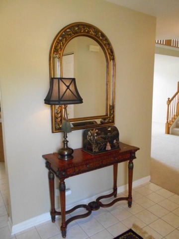3040 Crystal Rock Road, Unit 3040 Naperville, IL 60564 - Photo 3 of 22 a room with a table and a mirror