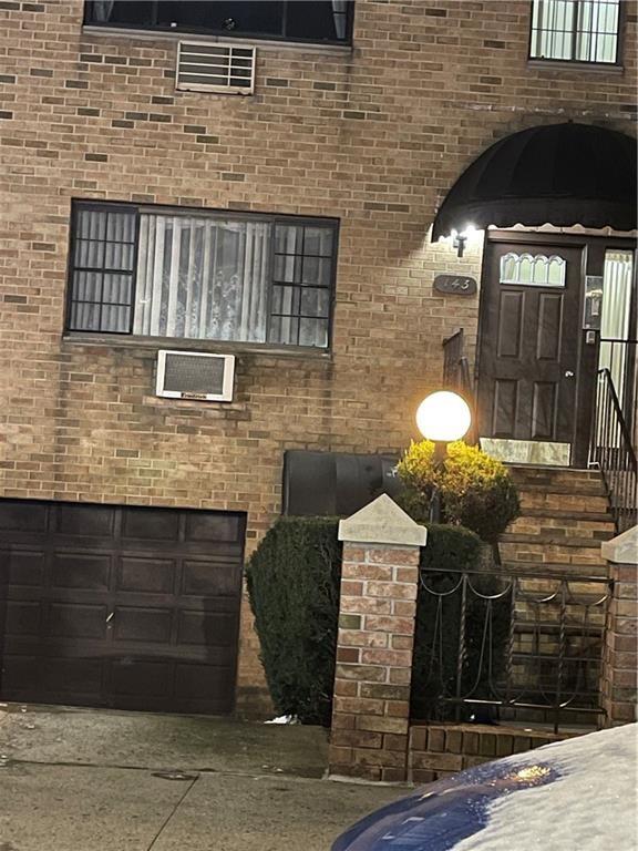 143 Bay 20th Street, Unit 5 Brooklyn, NY 11214 - Photo 1 of 11 a front view of a house with a yard