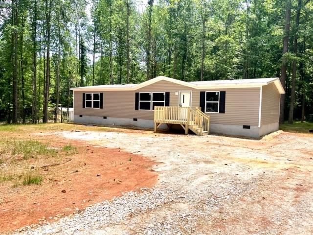 1570 Crumps Bridge Road Martin, GA 30557 - Photo 1 of 1 a front view of a house with a yard covered with snow