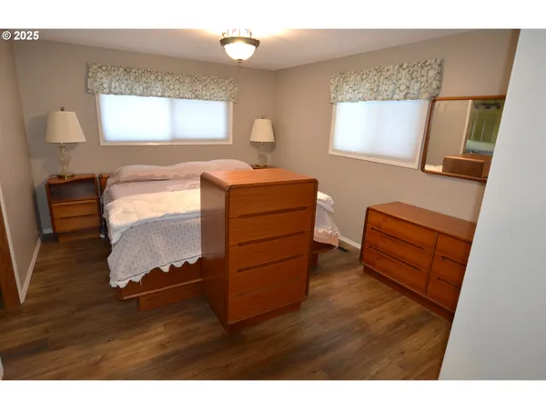 a bathroom with a sink a mirror and a shower