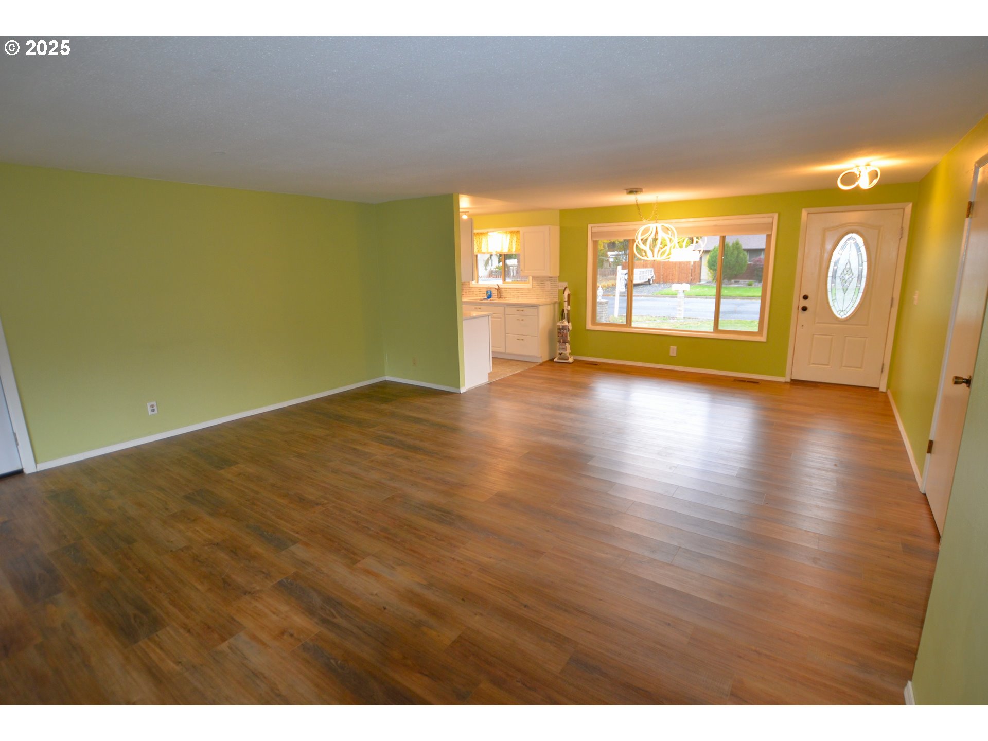 1437 Southwest 40th Street Pendleton, OR 97801 - Photo 27 of 40 a view of an empty room with window and wooden floor