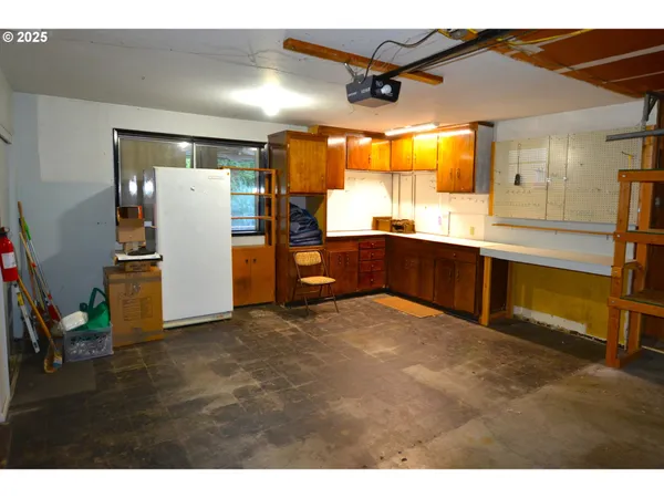 a kitchen with stainless steel appliances granite countertop a refrigerator a sink and dishwasher