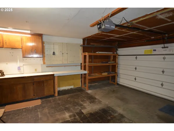 a kitchen with a cabinets and chandelier