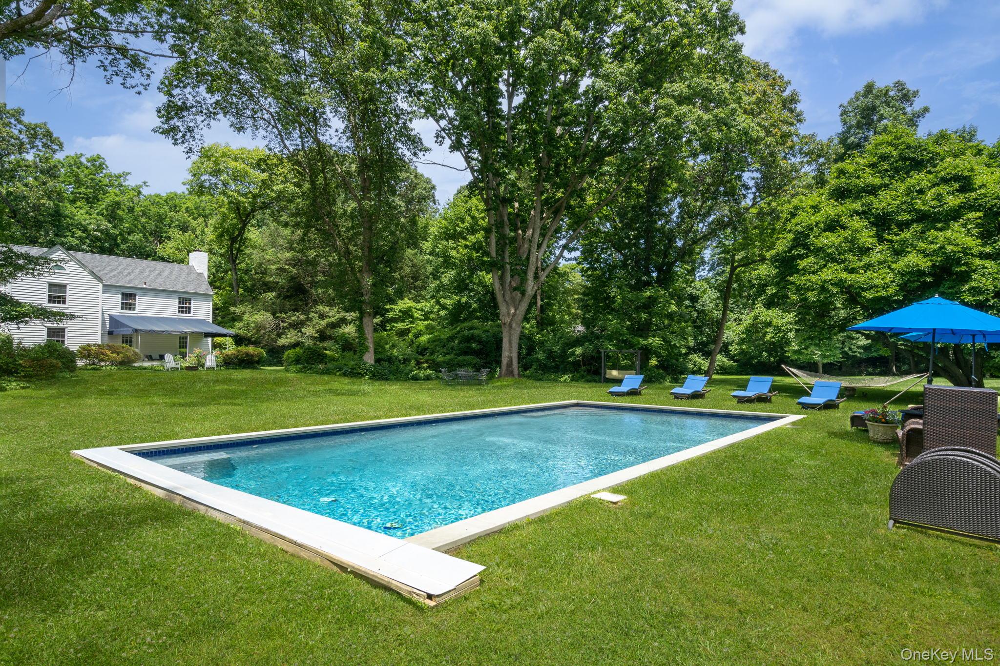 342 Woodbury Road Cold Spring Harbor, NY 11724 - Photo 24 of 29 a view of pool with a yard