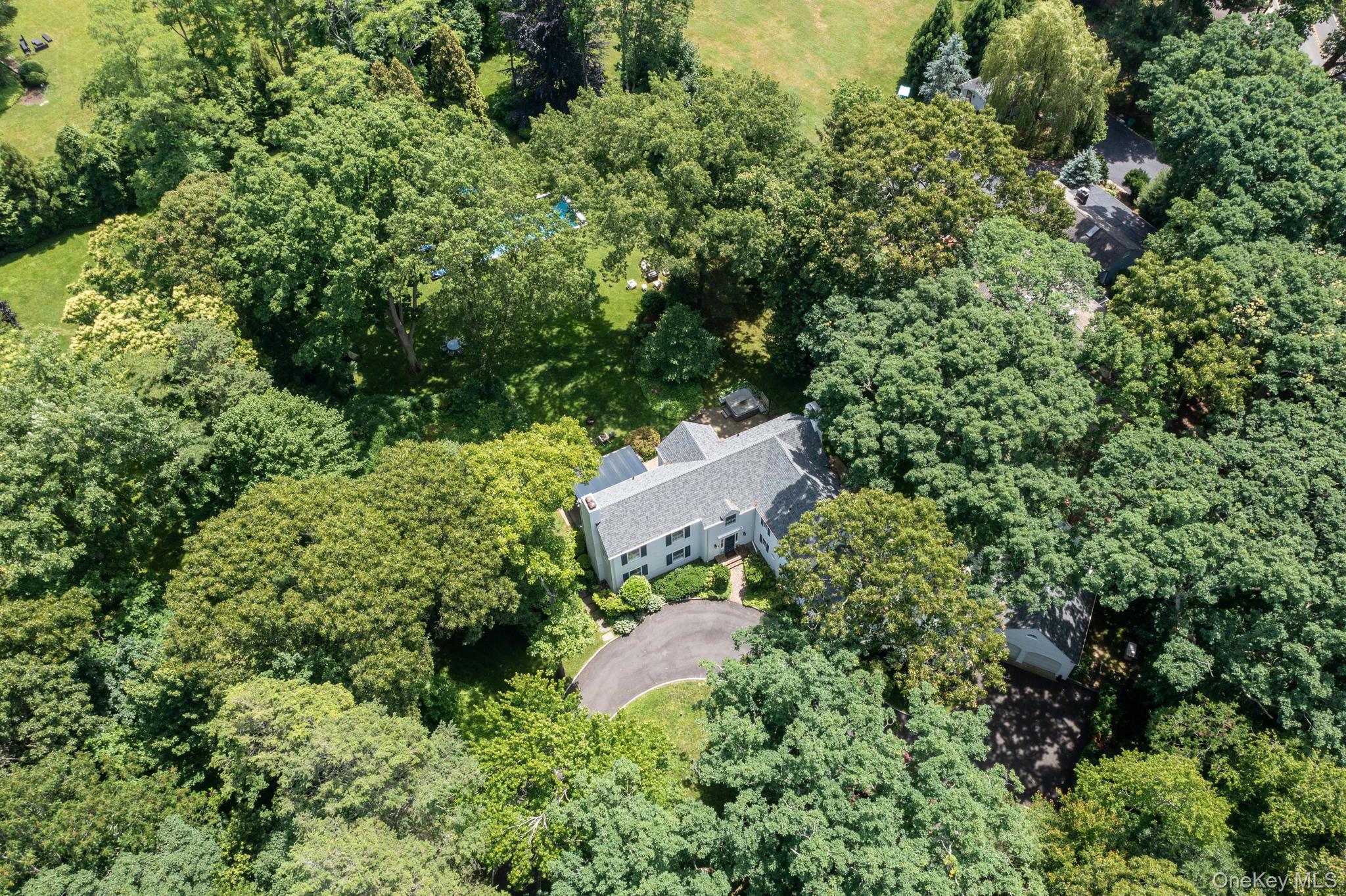 342 Woodbury Road Cold Spring Harbor, NY 11724 - Photo 29 of 29 an aerial view of a house with a yard