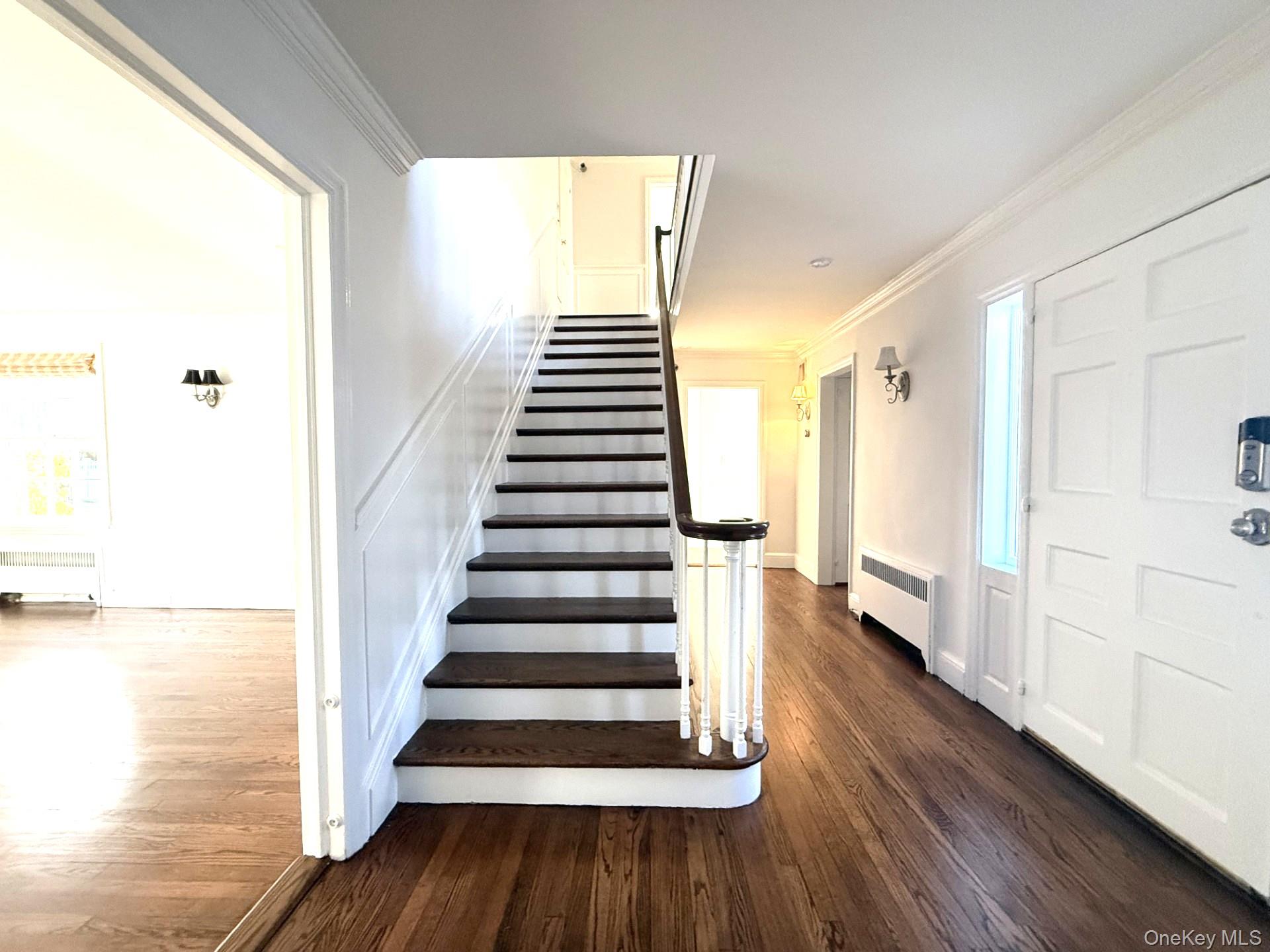 342 Woodbury Road Cold Spring Harbor, NY 11724 - Photo 4 of 29 a view of entryway with wooden floor