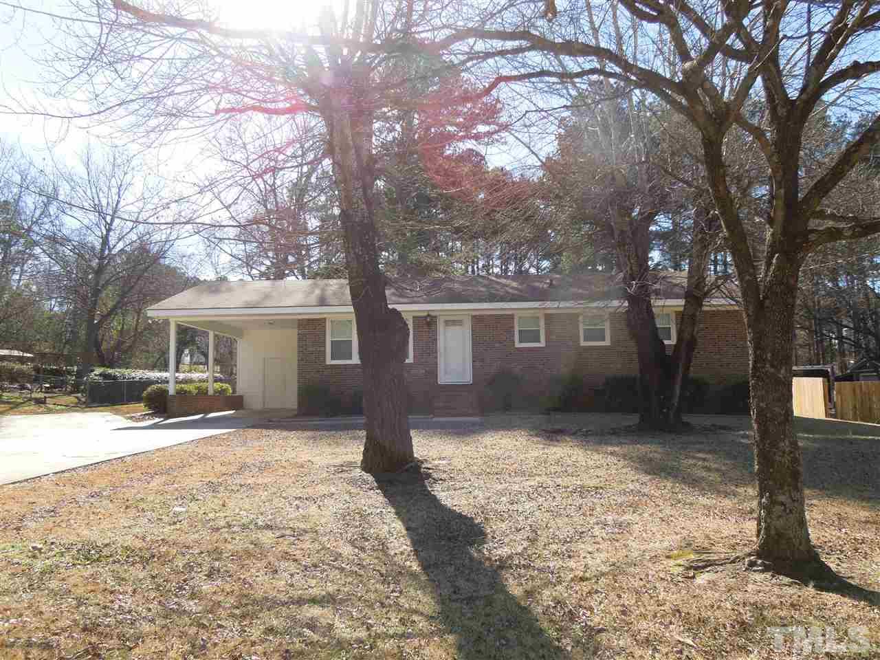 529 Maple Lane Raleigh, NC 27603 - Photo 2 of 21 a front view of a house with a yard covered in snow