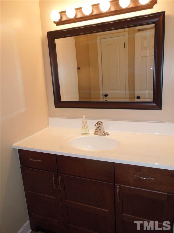 529 Maple Lane Raleigh, NC 27603 - Photo 11 of 21 a bathroom with a sink vanity and mirror