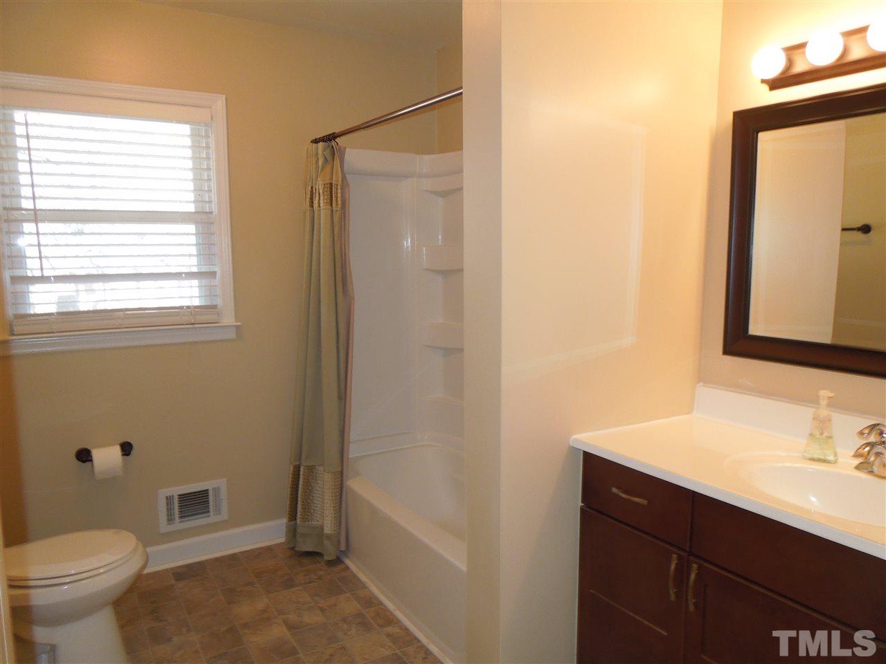 529 Maple Lane Raleigh, NC 27603 - Photo 12 of 21 a bathroom with a sink a toilet and shower