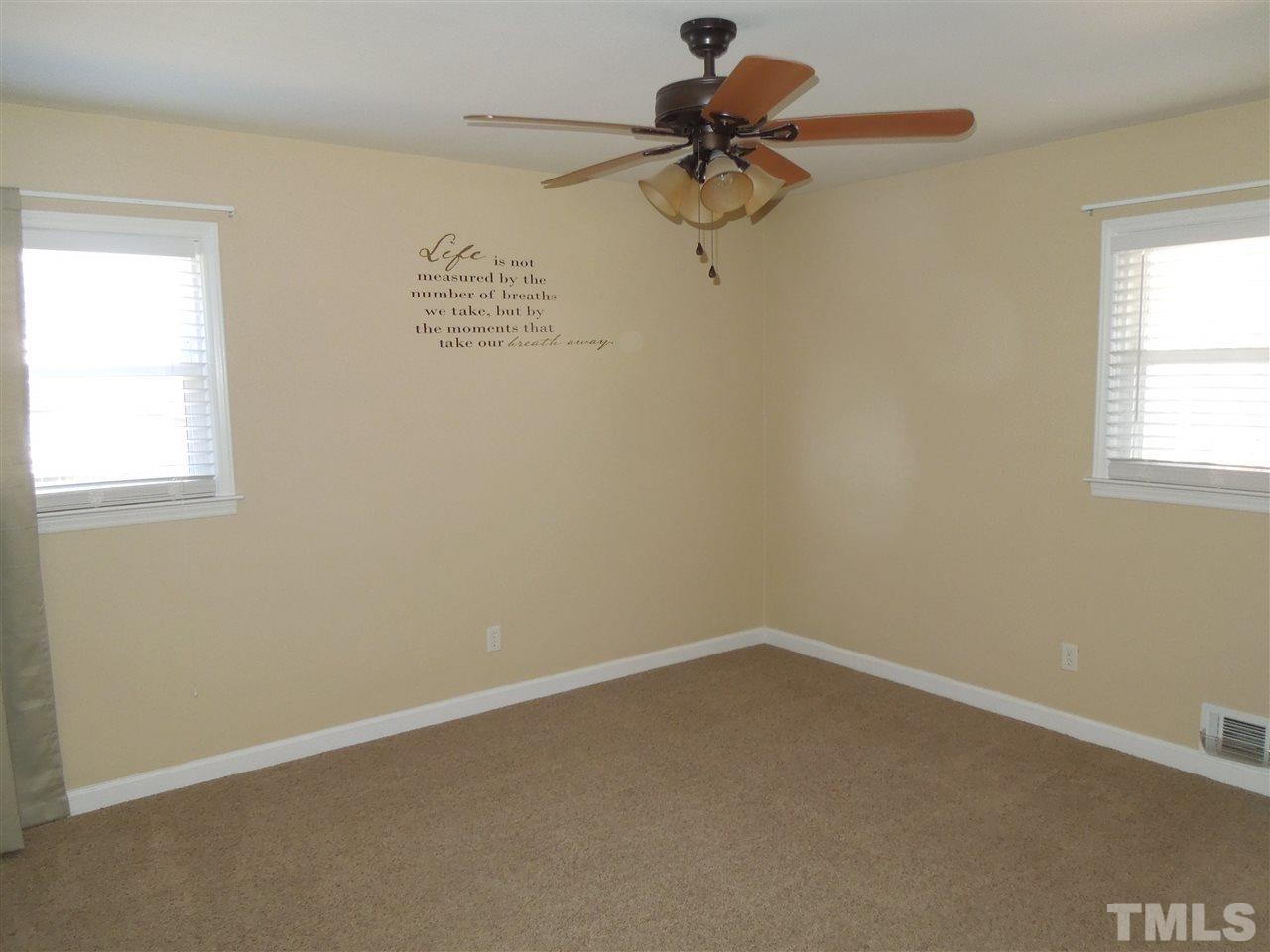 529 Maple Lane Raleigh, NC 27603 - Photo 13 of 21 an empty room with a window