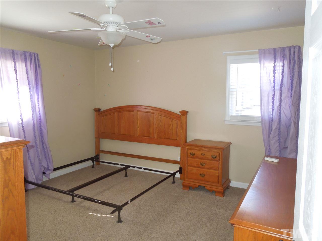529 Maple Lane Raleigh, NC 27603 - Photo 15 of 21 a living room with furniture and a window