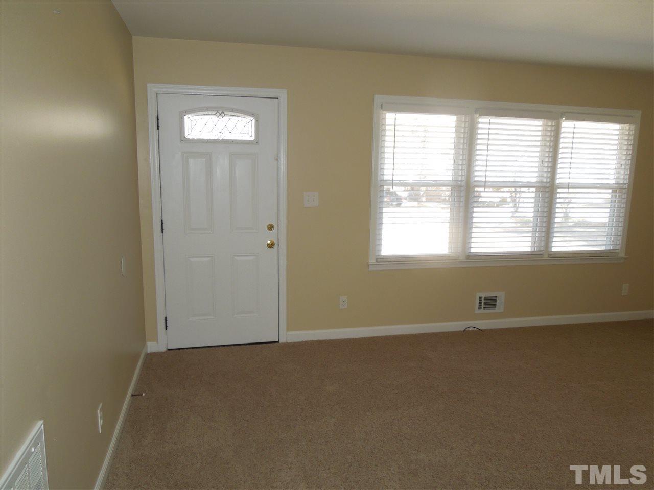 529 Maple Lane Raleigh, NC 27603 - Photo 3 of 21 a view of an empty room with a window