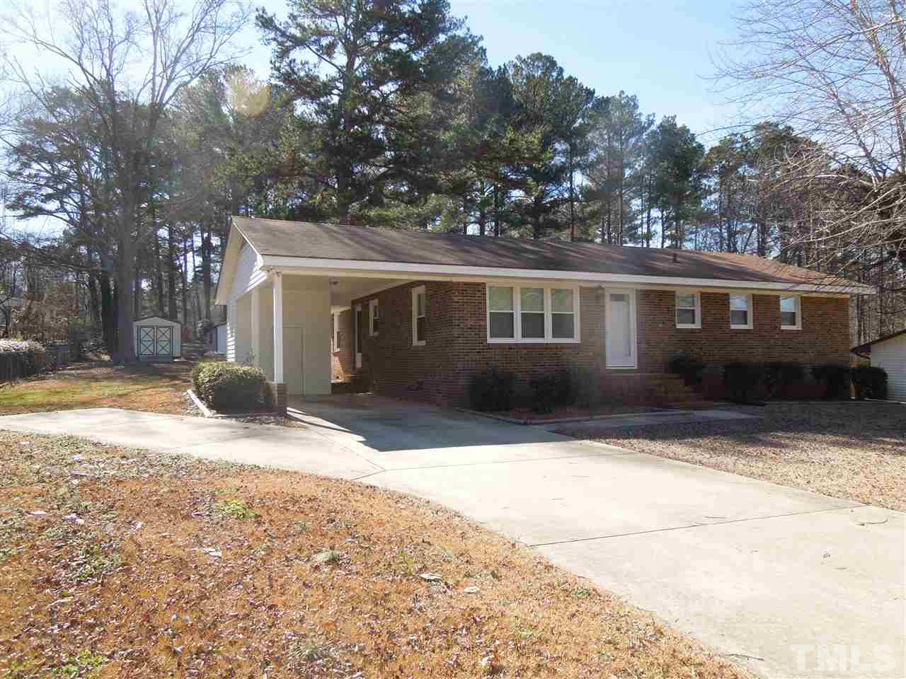 529 Maple Lane Raleigh, NC 27603 - Photo 21 of 21 a house with trees in front of it