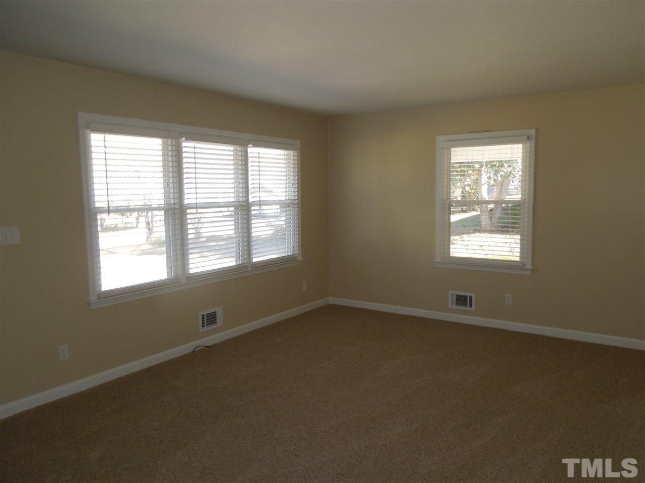 529 Maple Lane Raleigh, NC 27603 - Photo 4 of 21 an empty room with a window