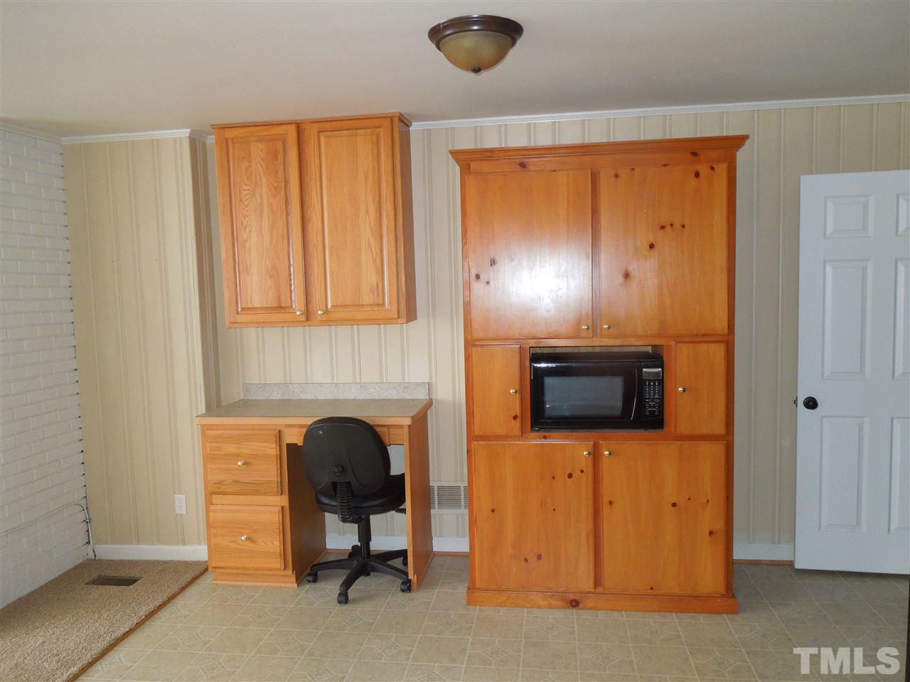529 Maple Lane Raleigh, NC 27603 - Photo 5 of 21 a living room with furniture and a fireplace