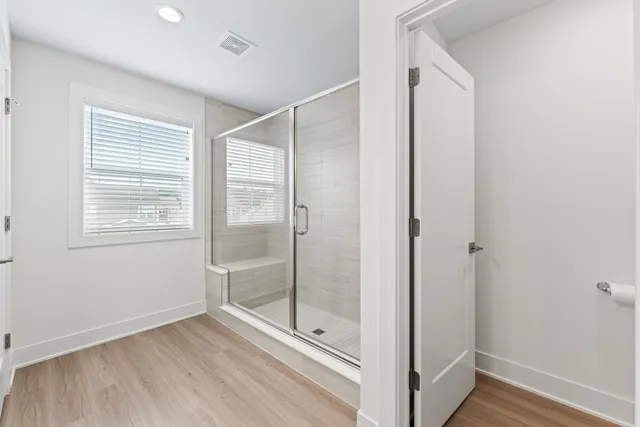a bathroom with a sink a large mirror and a toilet