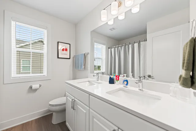 a aerial view of a brick house with a yard