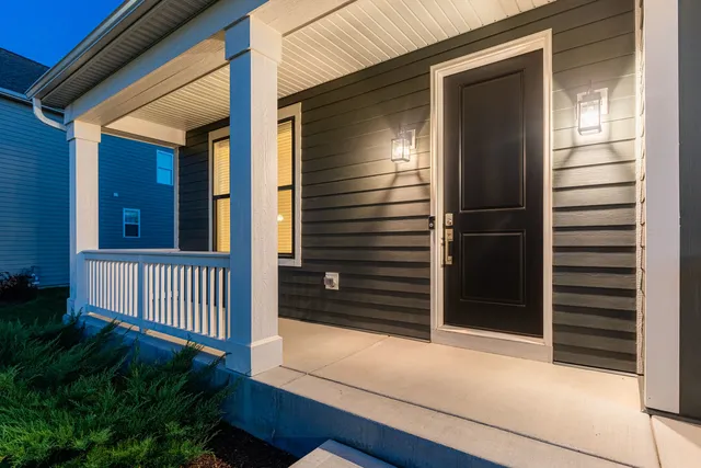 a aerial view of a house with a yard