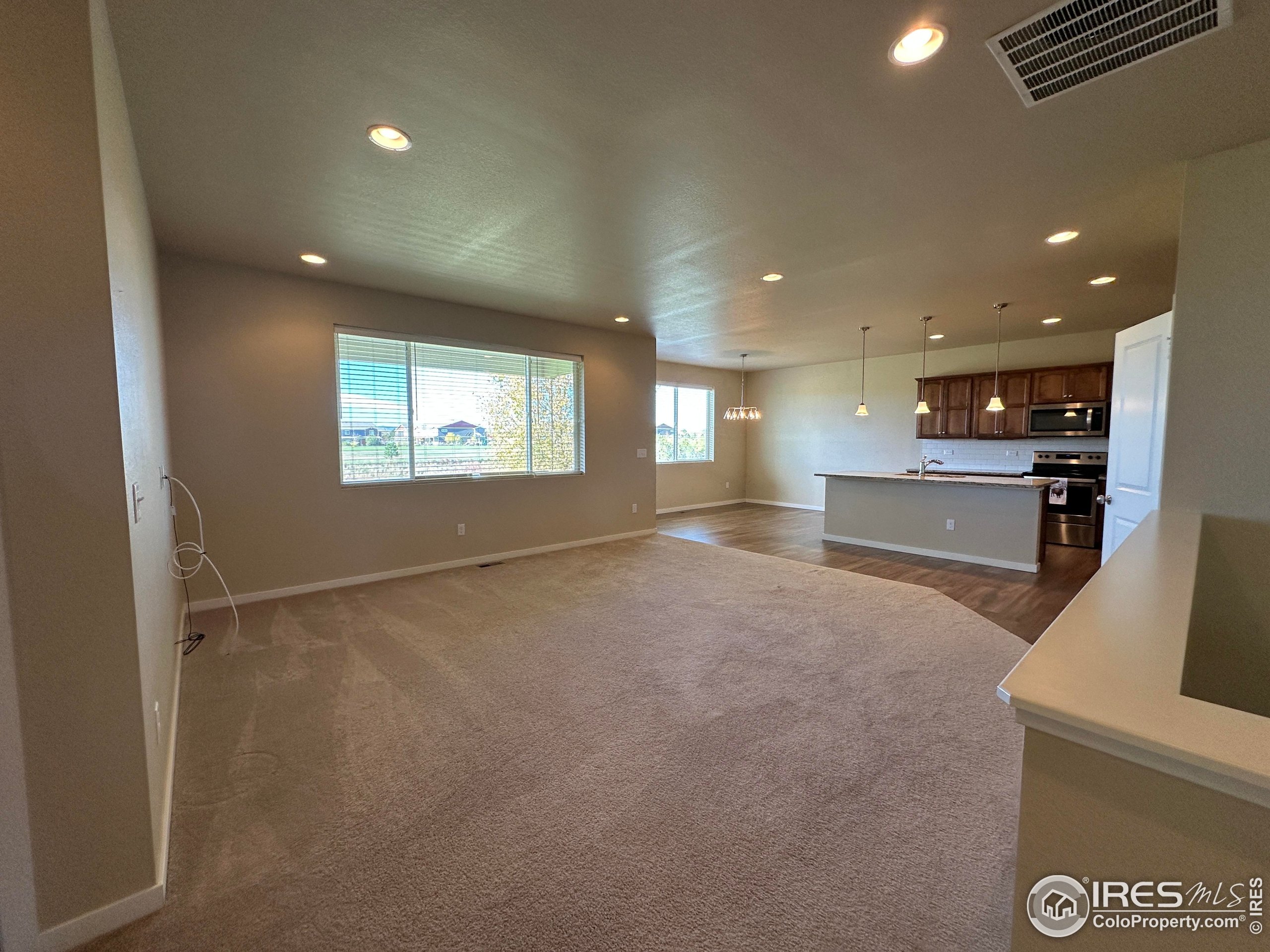 7213 Horsechestnut Street Wellington, CO 80549 - Photo 14 of 39 a view of an empty room with a window