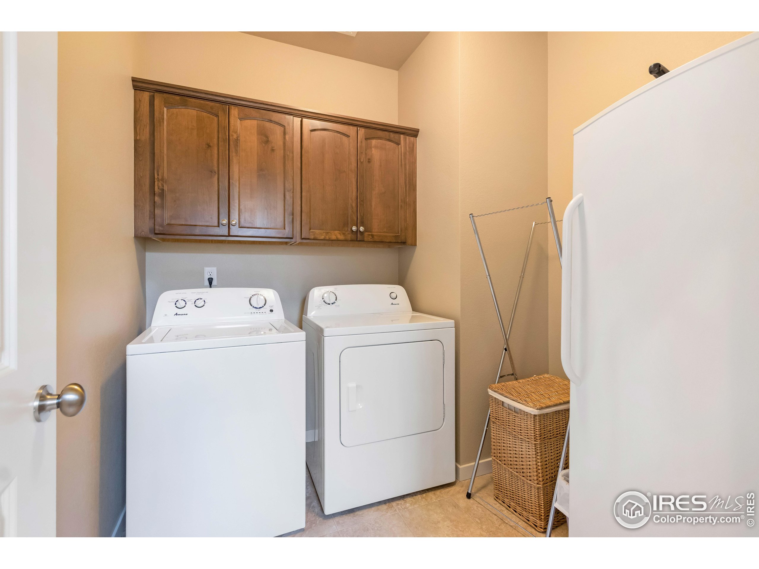 7213 Horsechestnut Street Wellington, CO 80549 - Photo 20 of 39 a utility room with dryer and washer