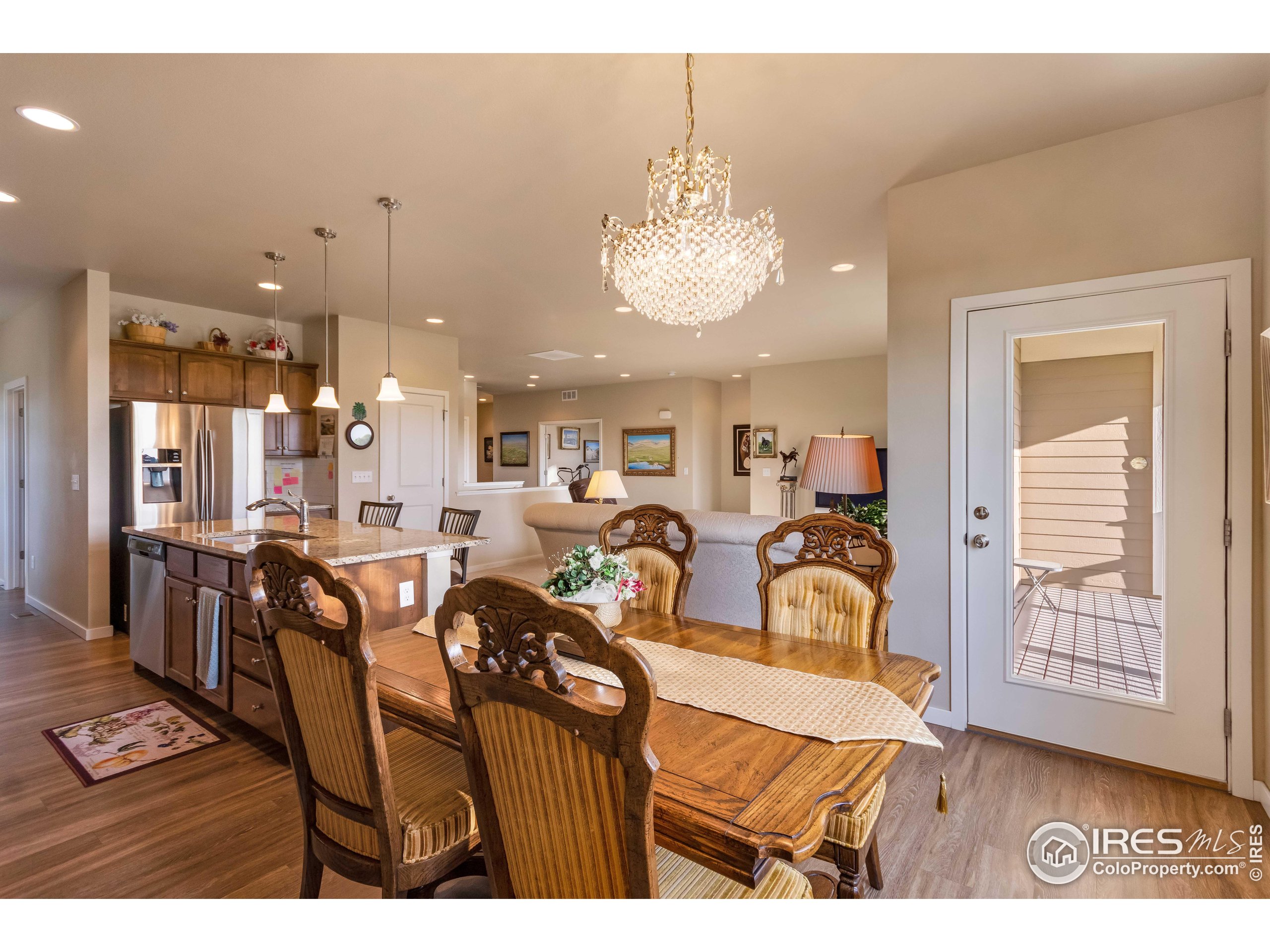 7213 Horsechestnut Street Wellington, CO 80549 - Photo 25 of 39 a view of a dining room and livingroom view