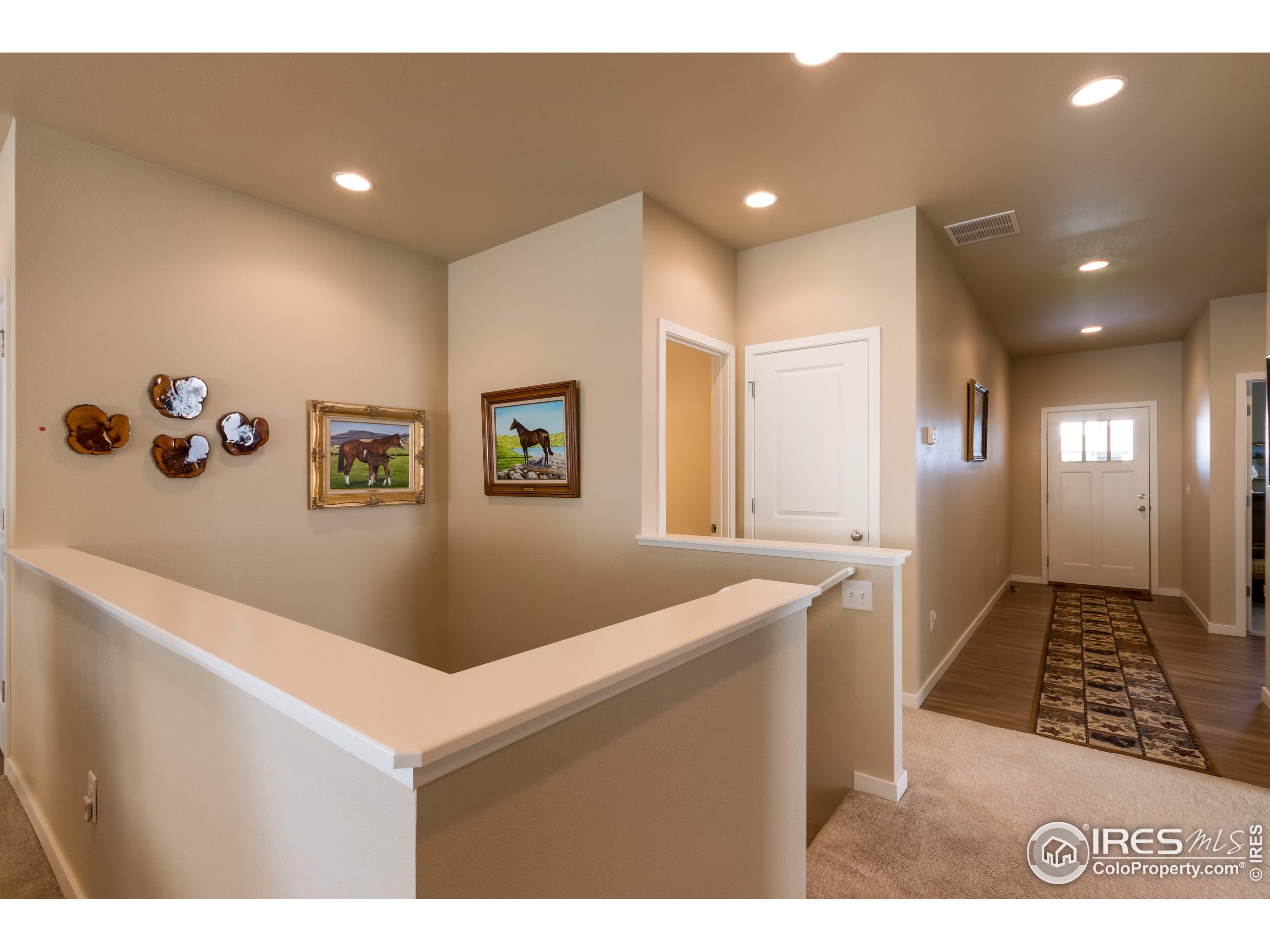 7213 Horsechestnut Street Wellington, CO 80549 - Photo 27 of 39 a view of kitchen with furniture and wooden floor