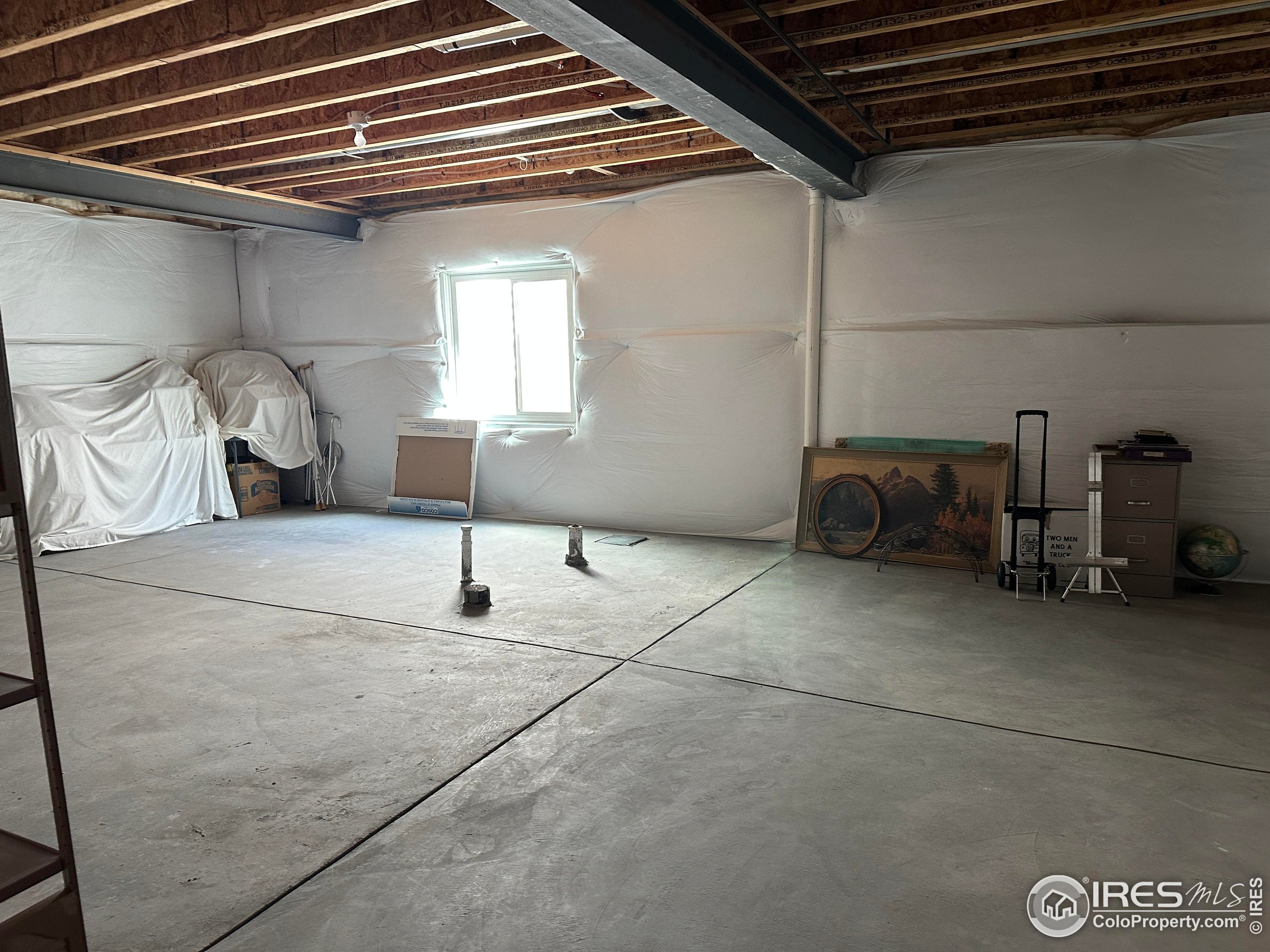 7213 Horsechestnut Street Wellington, CO 80549 - Photo 30 of 39 a bedroom with a bed and a table