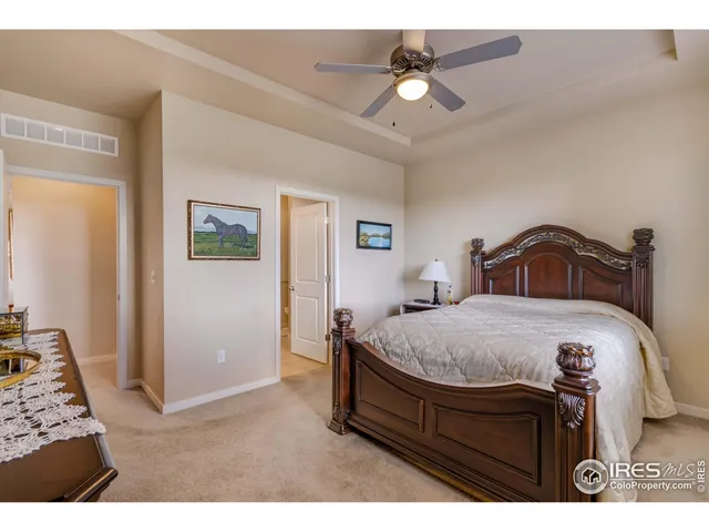 a living room with lots of furniture and a large window