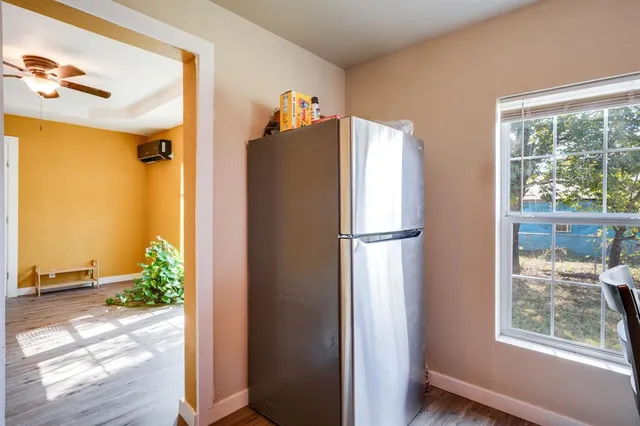 a refrigerator freezer sitting inside of a kitchen