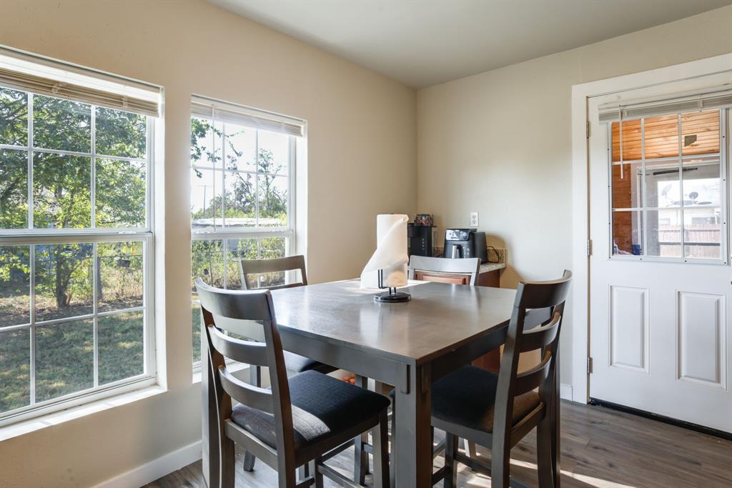 300 South Wall Street Itasca, TX 76055 - Photo 15 of 34 a view of a dining room with a table and chairs