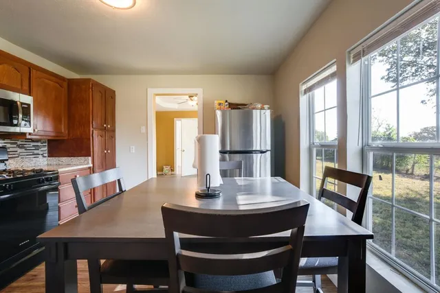 a view of a dining room with furniture window and outside view