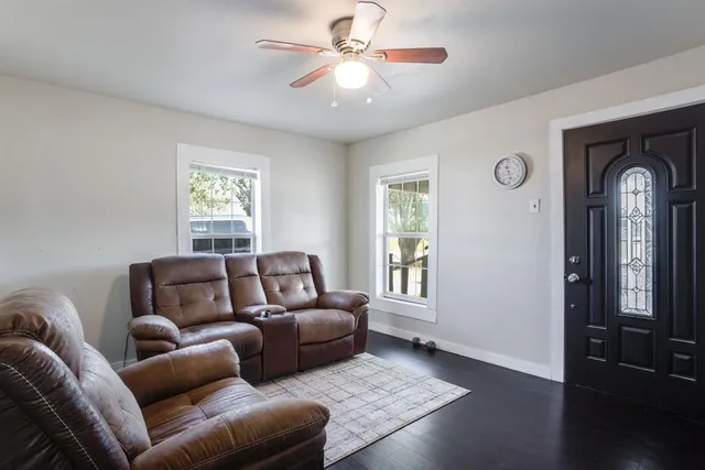 a living room with furniture and a window