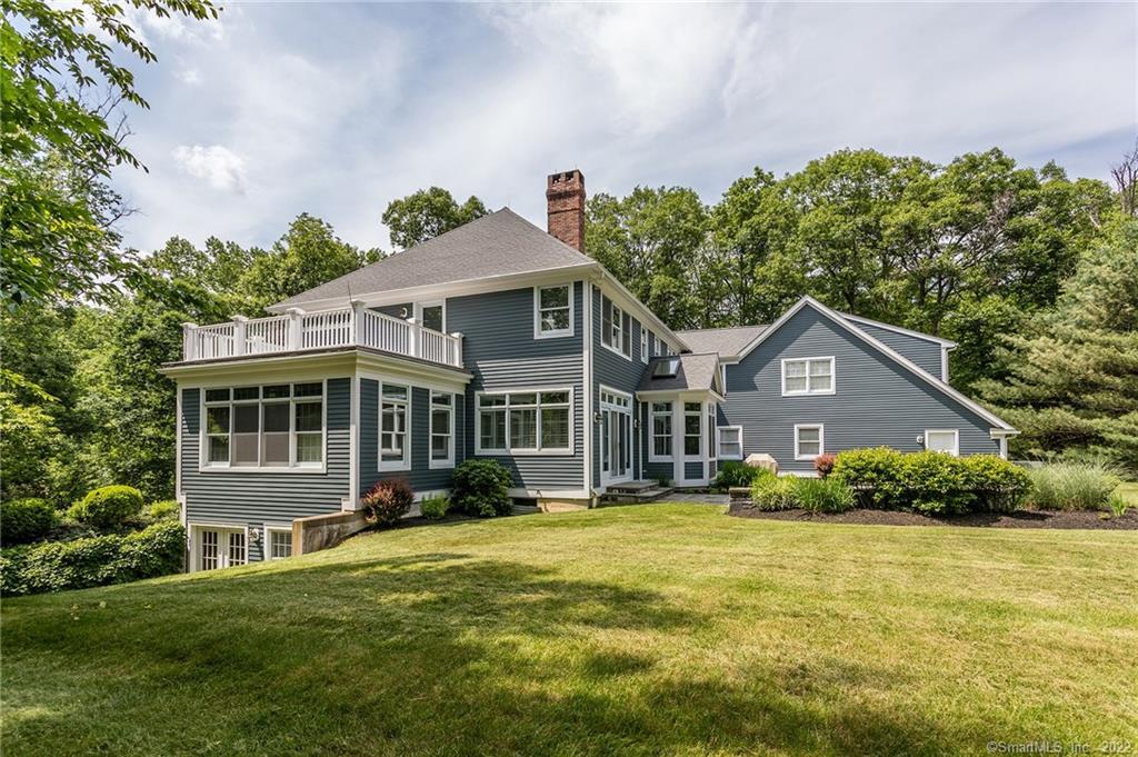 9 Shelter Cove Road Sherman, CT 06784 - Photo 1 of 1 a front view of a house with a yard
