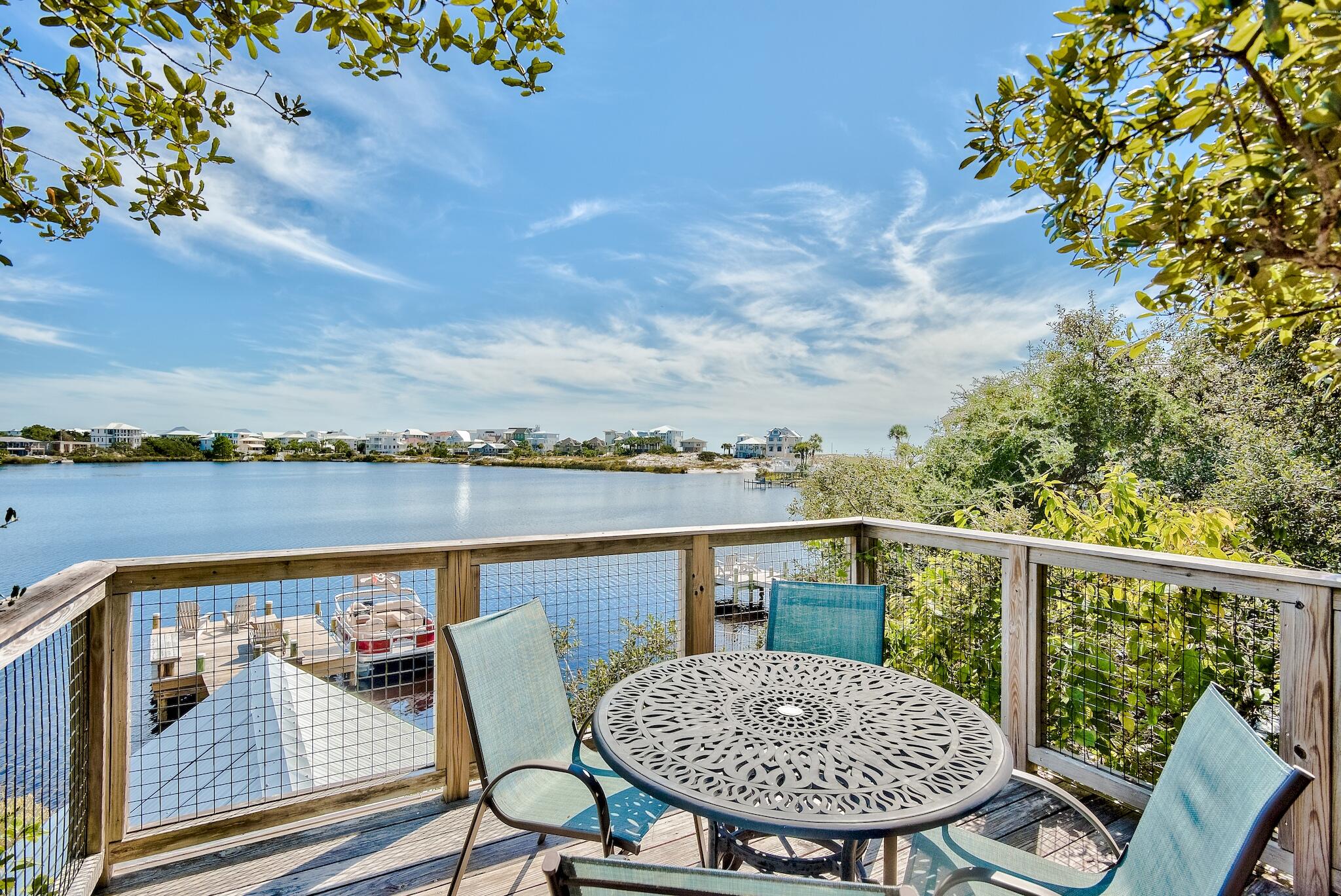 291 South Gulf Drive Santa Rosa Beach, FL 32459 - Photo 1 of 23 a view of a chairs and table in patio
