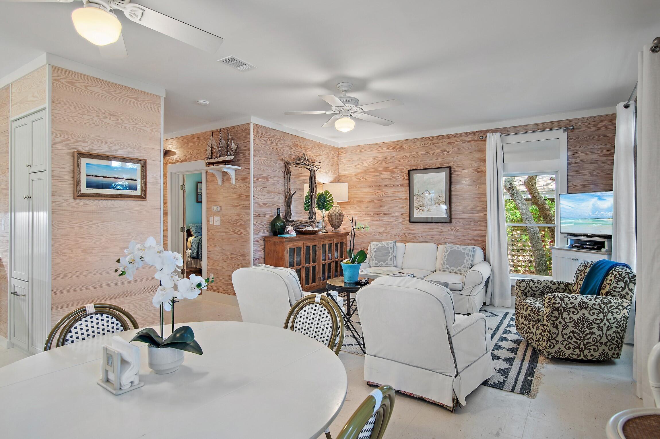 291 South Gulf Drive Santa Rosa Beach, FL 32459 - Photo 17 of 23 a living room with furniture and a chandelier