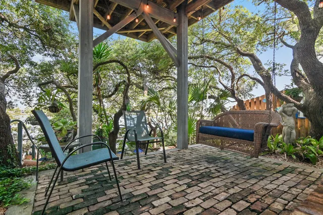 a view of a bench in a backyard