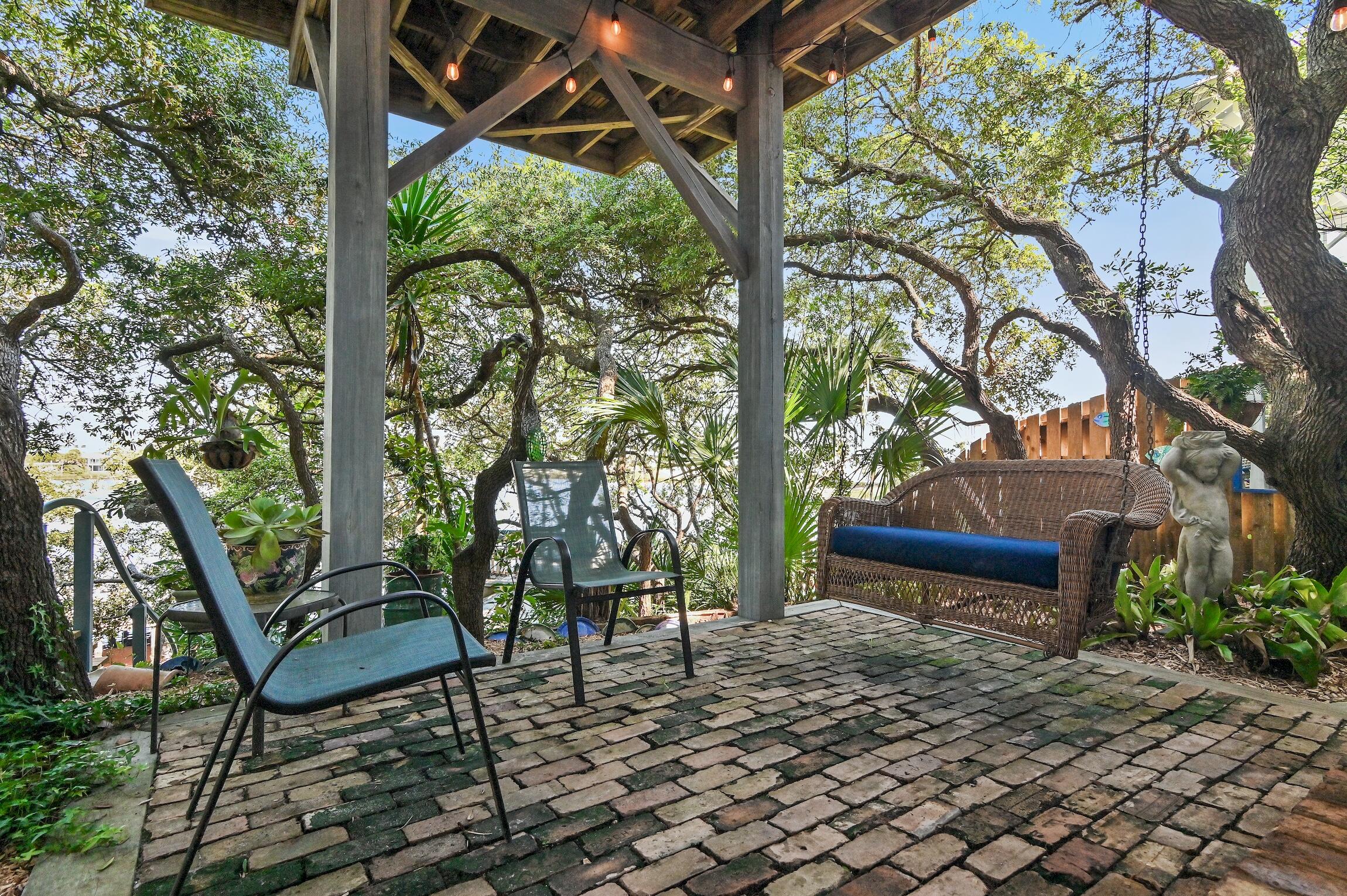 291 South Gulf Drive Santa Rosa Beach, FL 32459 - Photo 20 of 23 a view of a bench in a backyard