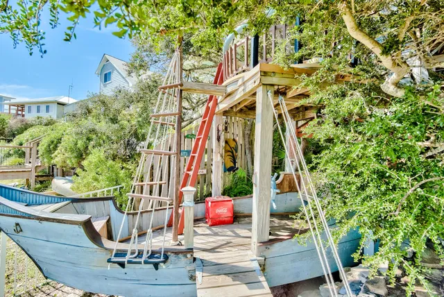 a view of potted plants and trees in the roof deck