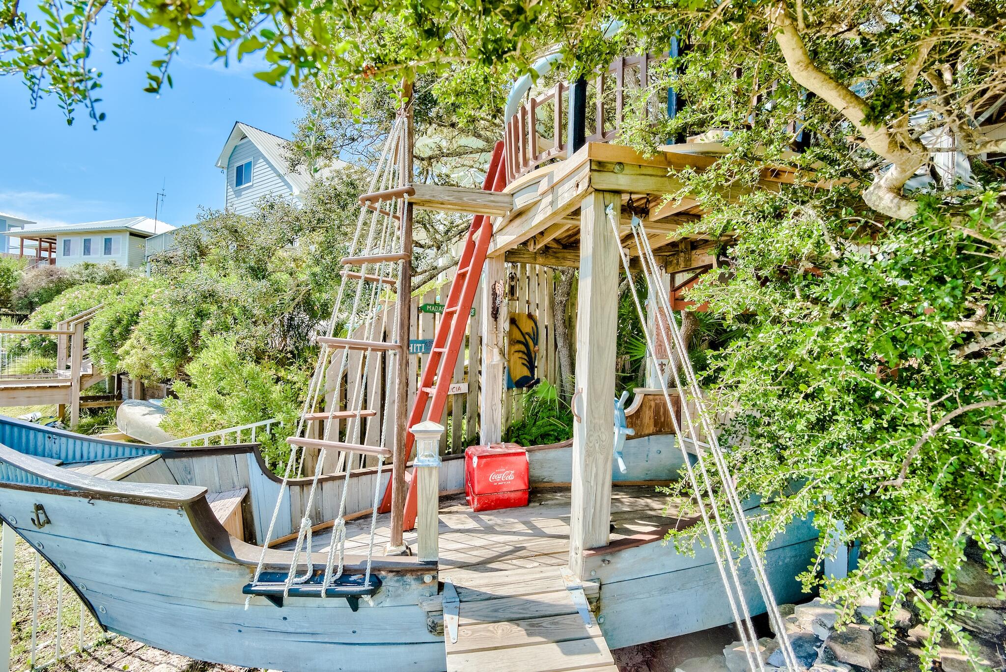 291 South Gulf Drive Santa Rosa Beach, FL 32459 - Photo 21 of 23 a view of potted plants and trees in the roof deck