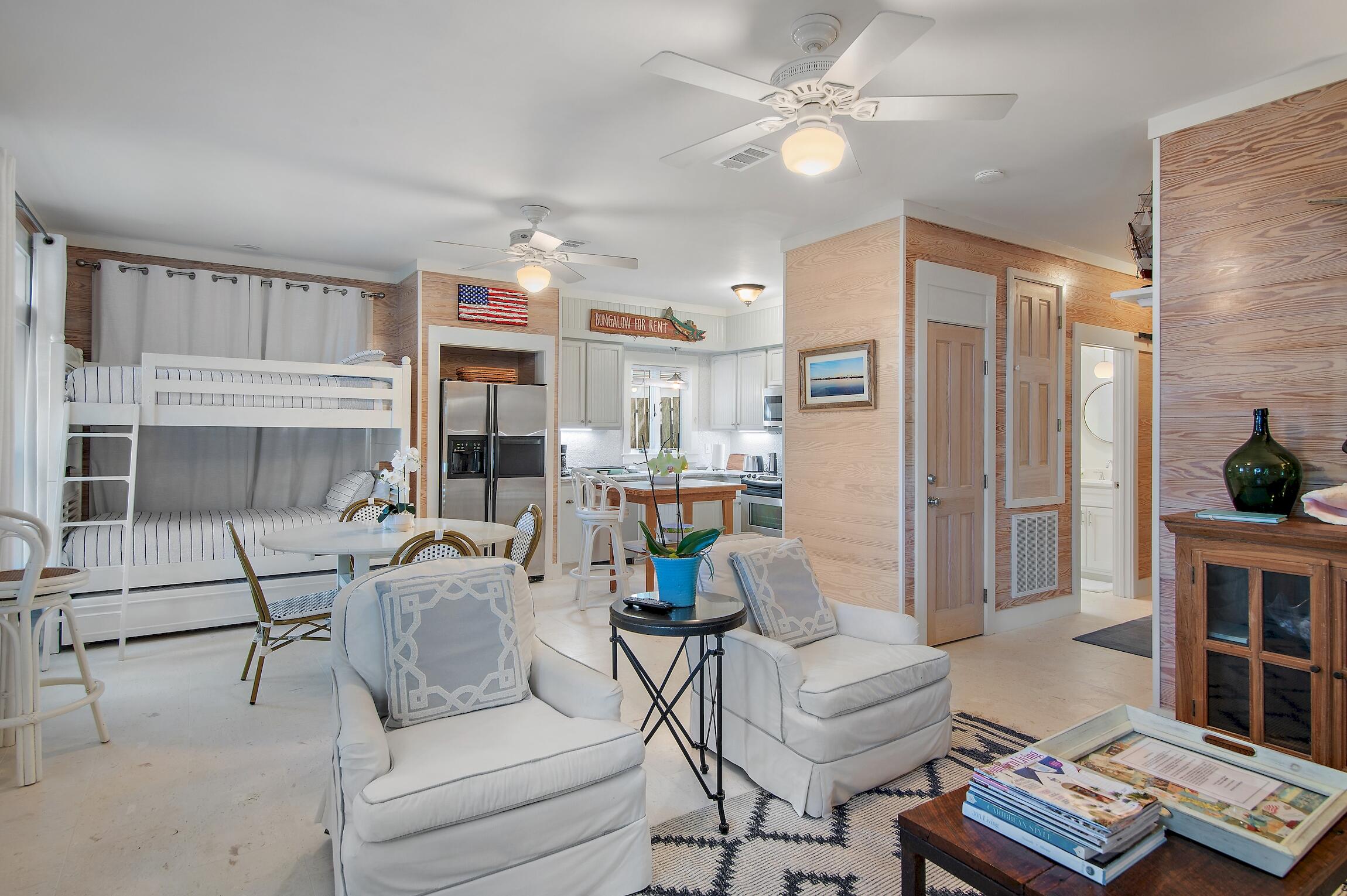 291 South Gulf Drive Santa Rosa Beach, FL 32459 - Photo 3 of 23 a living room with furniture and a fireplace