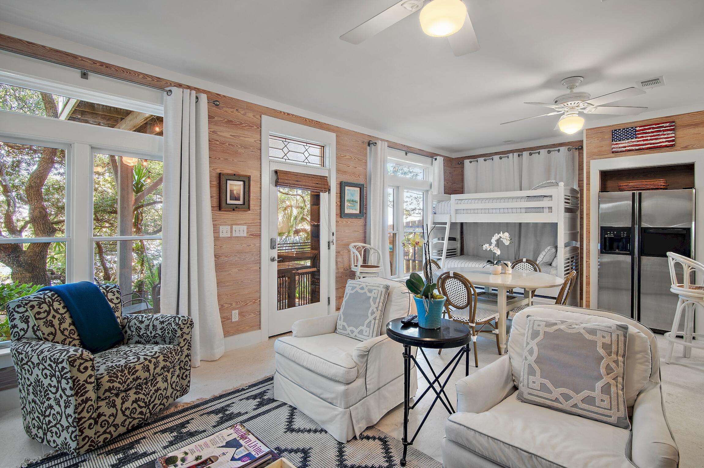 291 South Gulf Drive Santa Rosa Beach, FL 32459 - Photo 10 of 23 a living room with furniture and a floor to ceiling window