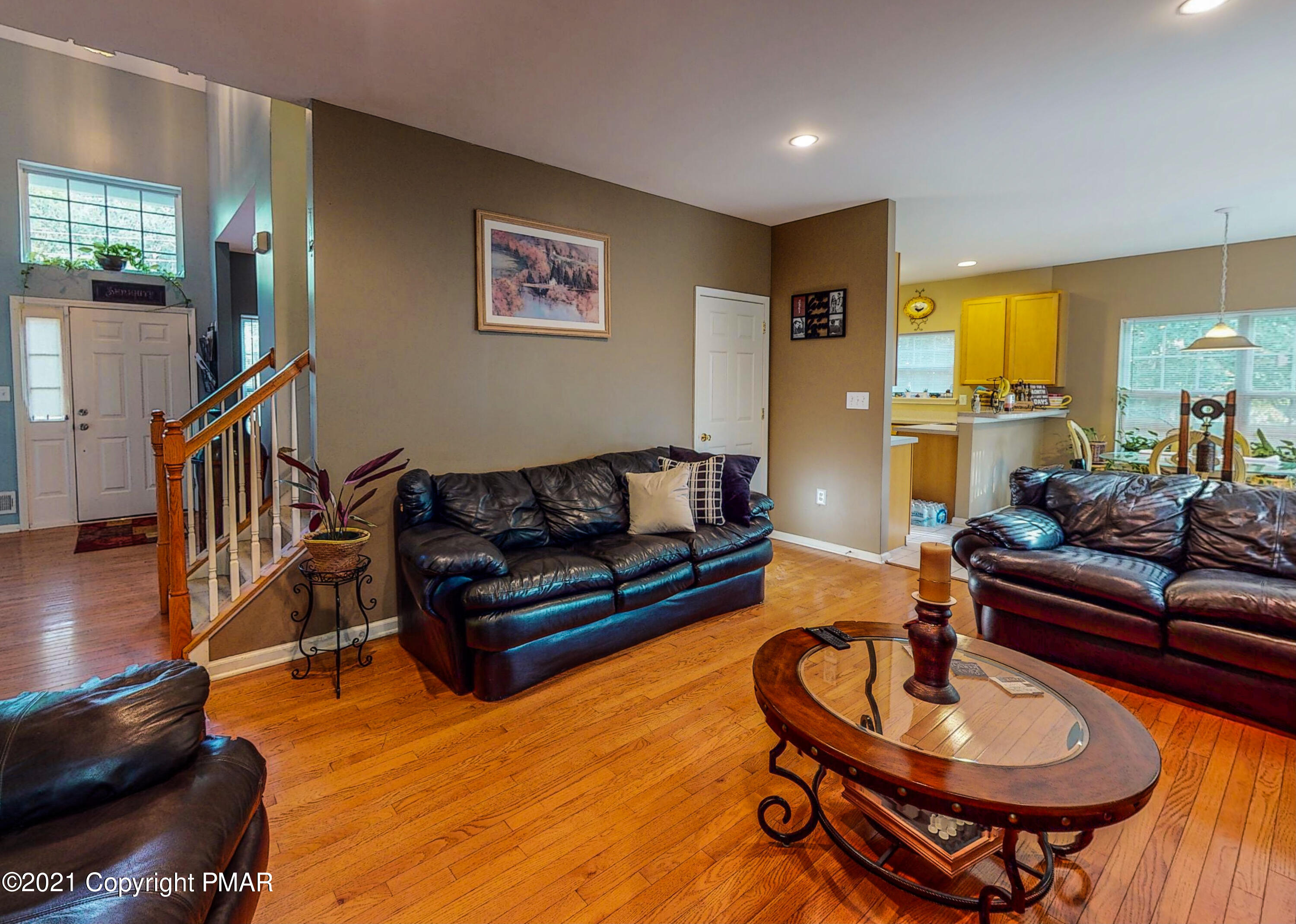 5631 Decker Road Bushkill, PA 18324 - Photo 13 of 61 a living room with furniture and a wooden floor