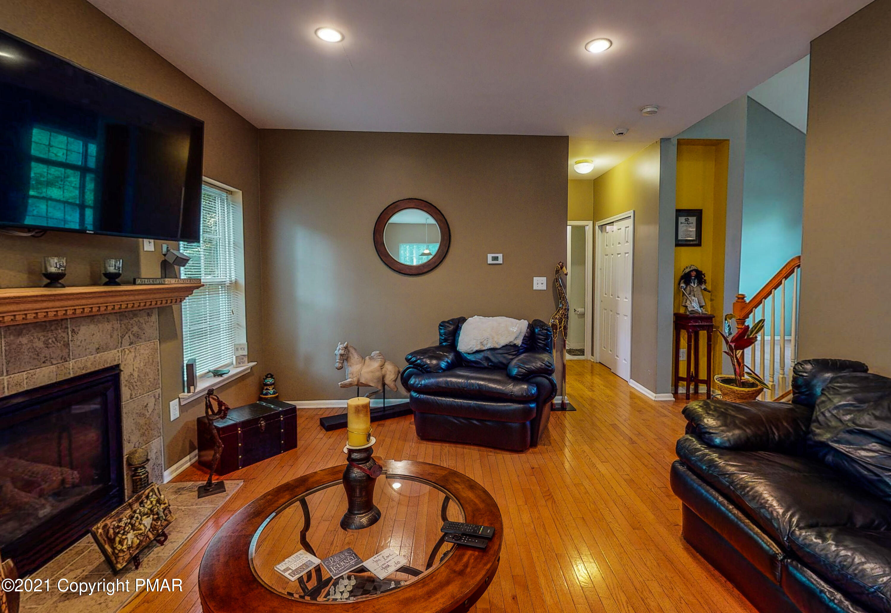 5631 Decker Road Bushkill, PA 18324 - Photo 14 of 61 a living room with furniture and a fireplace