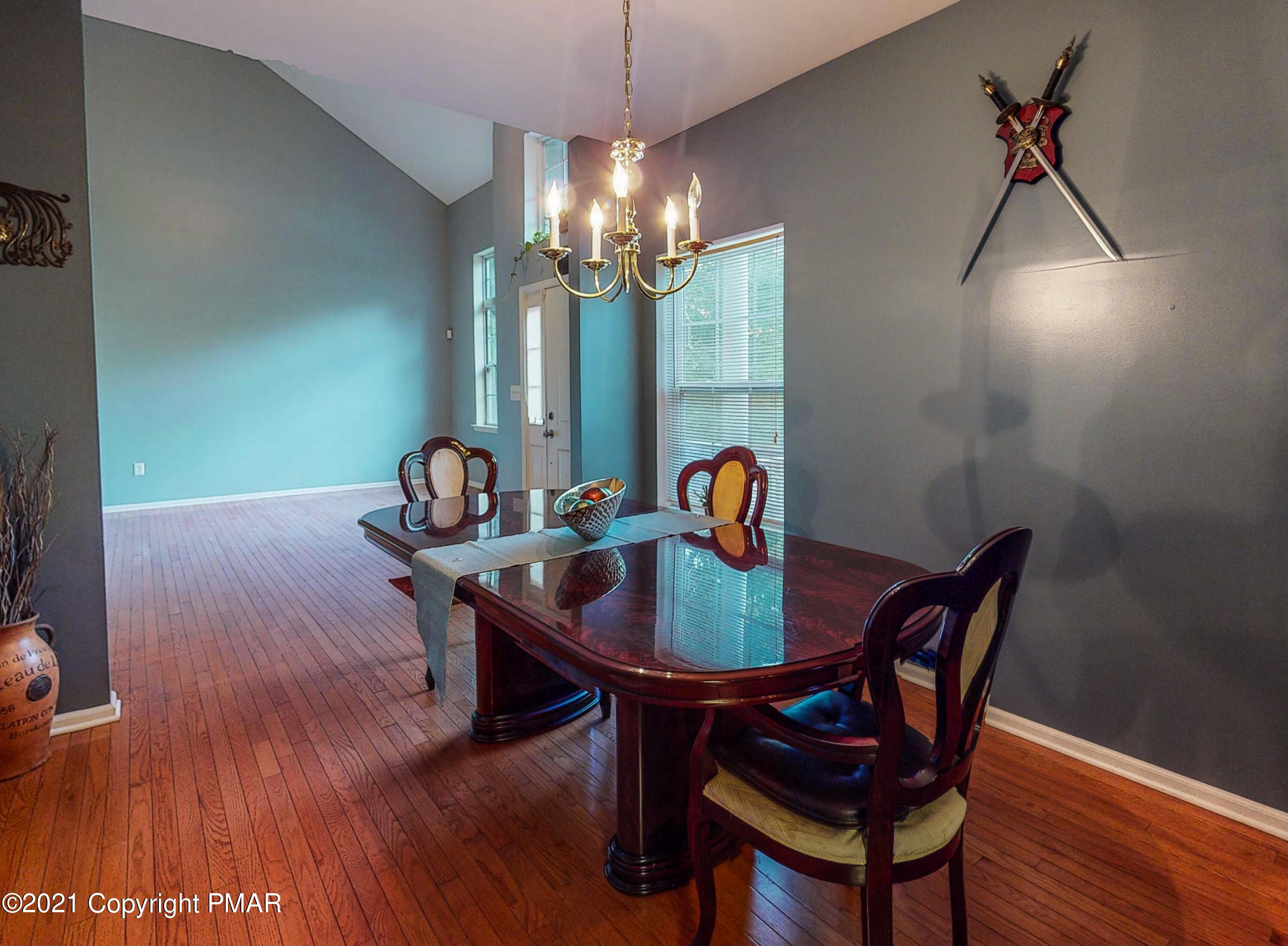 5631 Decker Road Bushkill, PA 18324 - Photo 17 of 61 a view of a dining room with furniture and wooden floor