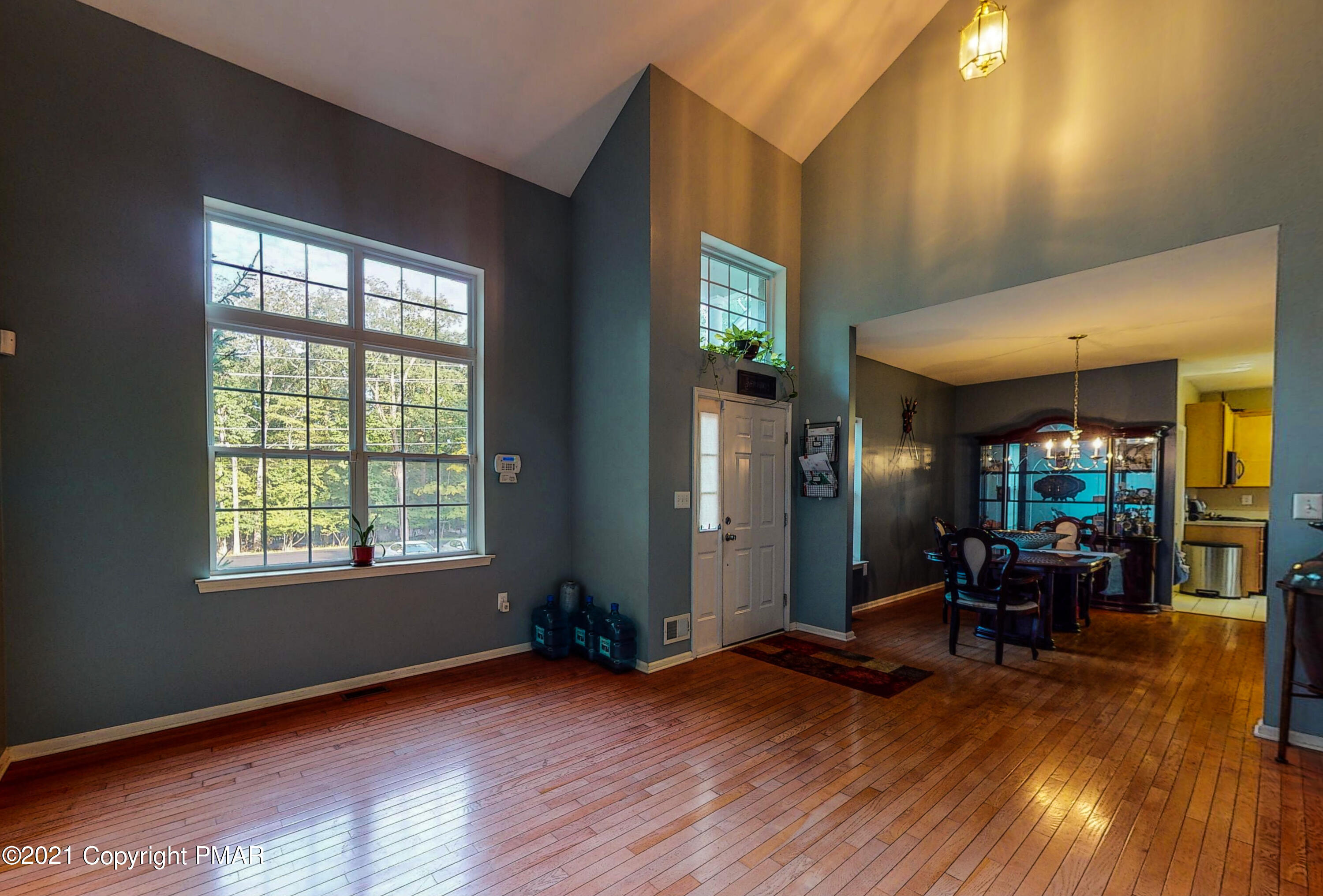 5631 Decker Road Bushkill, PA 18324 - Photo 18 of 61 a view of a livingroom with furniture window and wooden floor