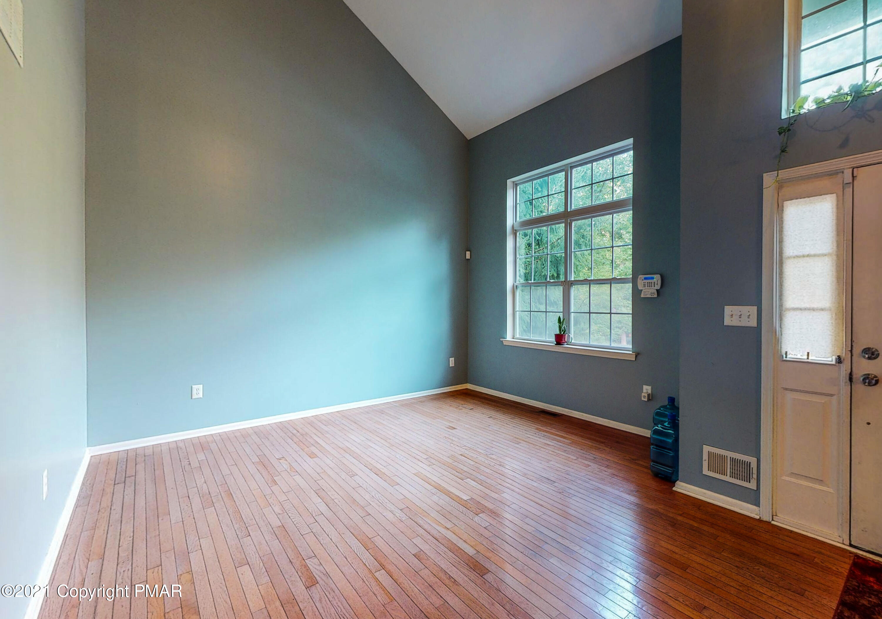 5631 Decker Road Bushkill, PA 18324 - Photo 20 of 61 an empty room with wooden floor and windows