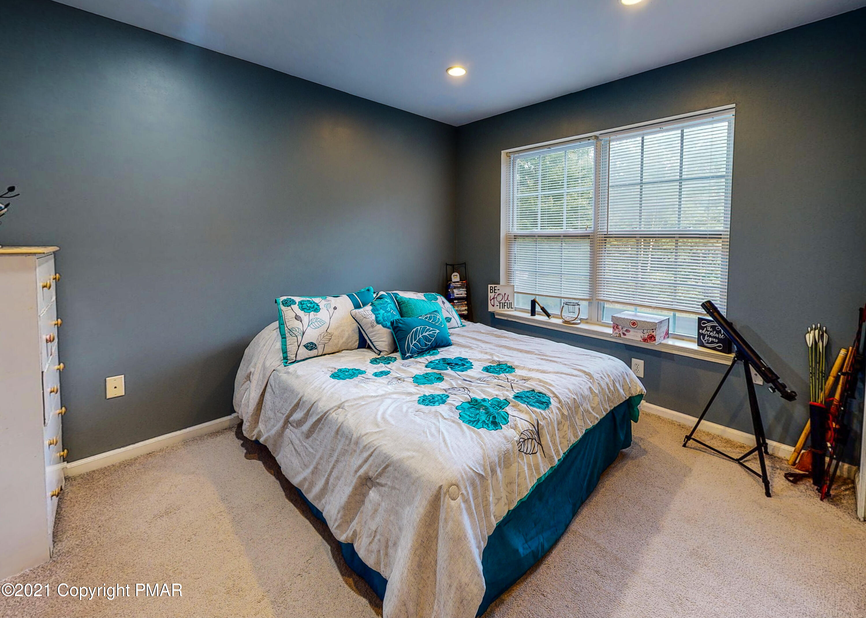 5631 Decker Road Bushkill, PA 18324 - Photo 33 of 61 a bedroom with a bed and a window