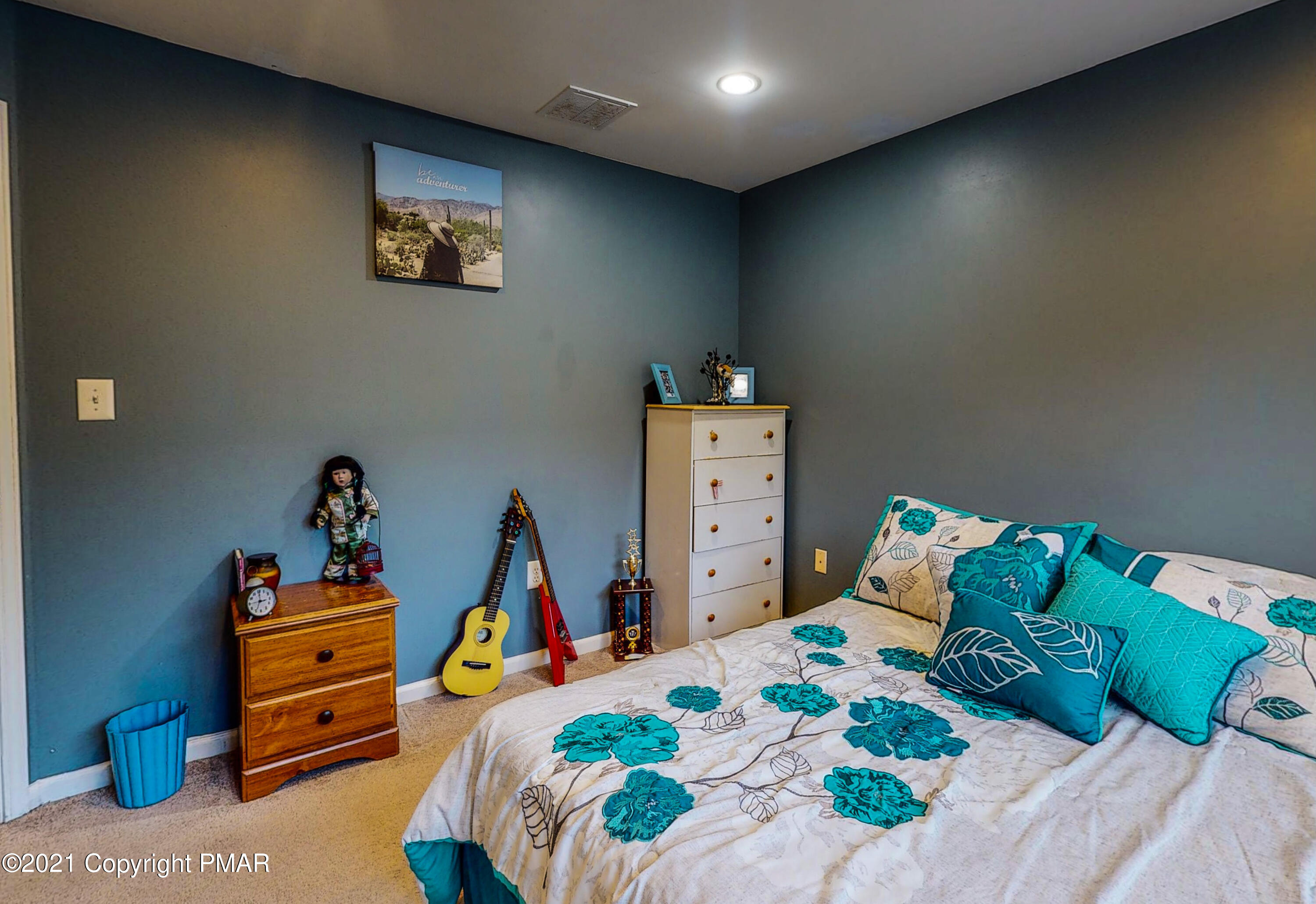 5631 Decker Road Bushkill, PA 18324 - Photo 34 of 61 a bedroom with a bed and a tv