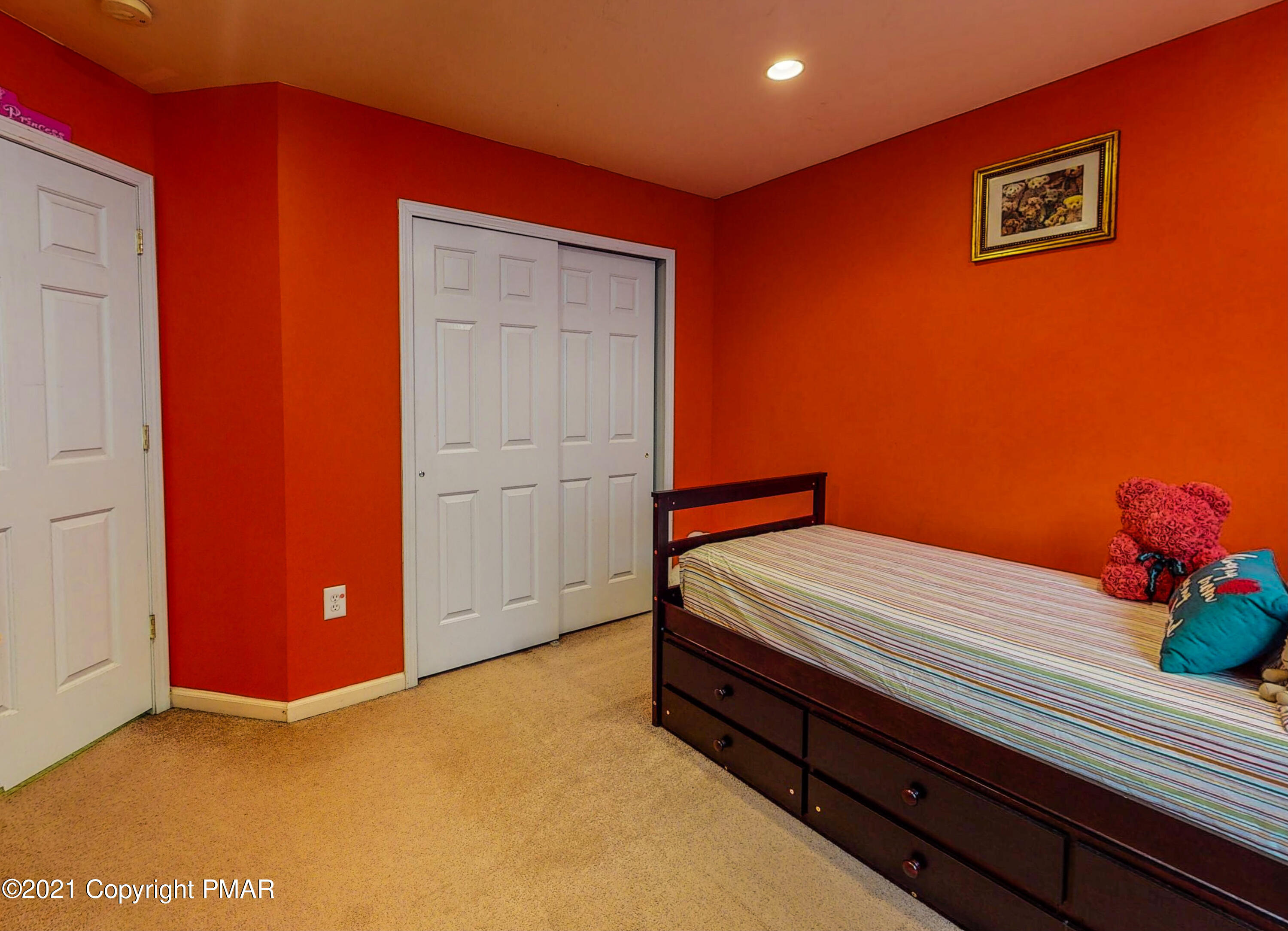 5631 Decker Road Bushkill, PA 18324 - Photo 37 of 61 a bed room with a bed and a potted plant